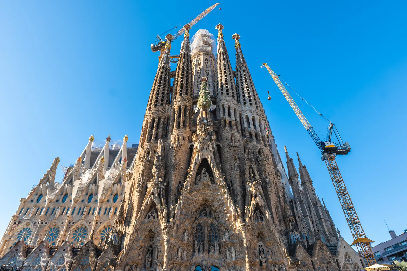 Nativity façade of the Sagrada Família in Barcelona, with construction cranes